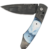 William Henry Knife The Spearpoint 'Dignity' features a frame of hand-forged 'Twist' damascus by Chad Nichols, inlaid with beautiful carved banded agate scales. The blade is hand-forged 'Flag' damascus by Chad Nichols; the one-hand button lock and the thu