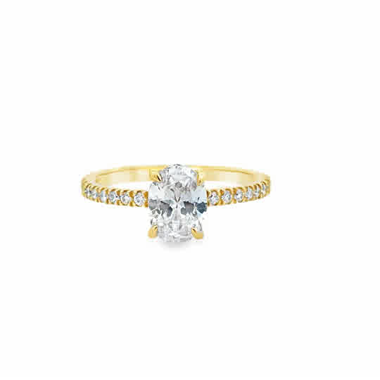 14 Karat Yellow Gold Engagement Ring Set with One Radiant Cubic Zirconium and .33ctw Round Brilliant Cut Diamonds.