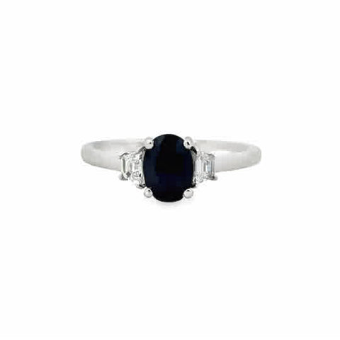 Platinum Three Stone Ring with an Oval Cut Sapphire, and Trapezoid Cut Diamonds