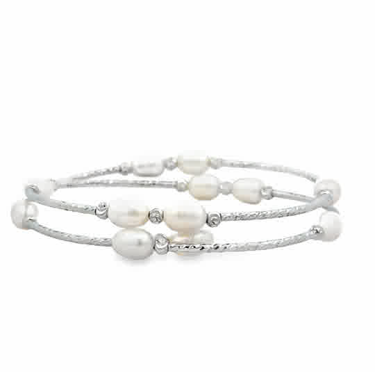 Made by 5.5mm freshwater cultured white rice pearls with open end. All pearls are very good luster and flawless. The length is flexible and fits everyone. It is dressy, light and comfortable to wear.