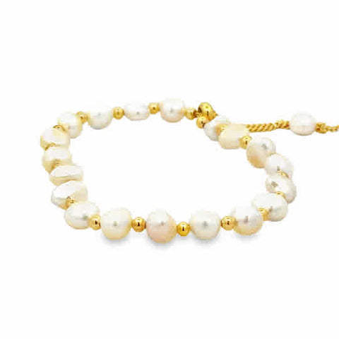 This chic bracelet is made of 6mm cultured white pearls with yellow gold plated chain. The chain can be adjusted from 6 inch to 9 inch.