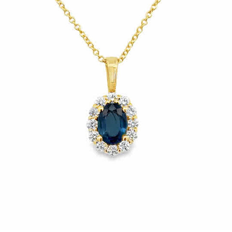 14 Karat Yellow Gold Halo Pendant with 7x5mm, "AA" Oval Cut Sapphire, with Round Brilliant Cut Diamonds