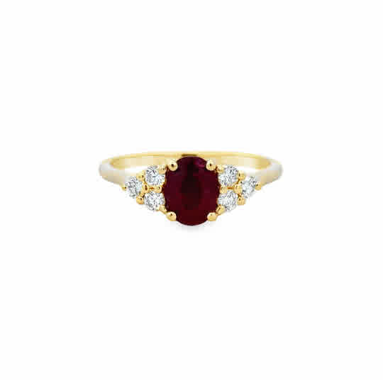 14 Karat Yellow Gold Fashion Ring with an Oval Cut Ruby, and Round Brilliant Cut Diamonds