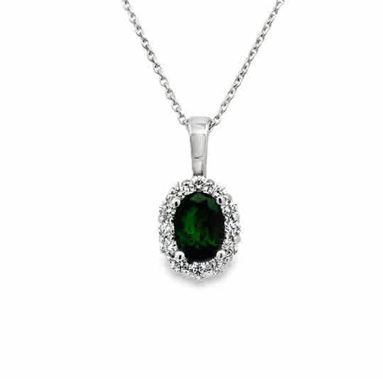 14 Karat White Gold Halo Pendant with 7x5mm, "AA" Oval Cut Emerald, with Round Brilliant Cut Diamonds